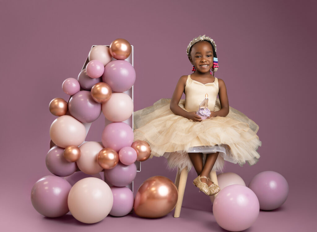 toddler taking 4th birthday photos at Atlanta studio. 
