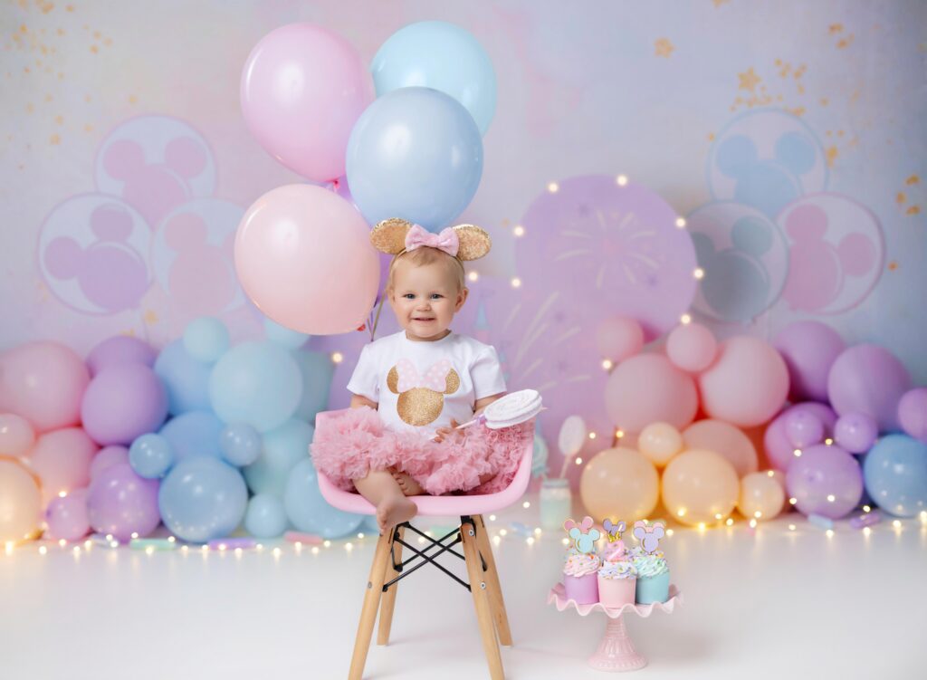 Oh Two-odles birthday set with little girl smiling.