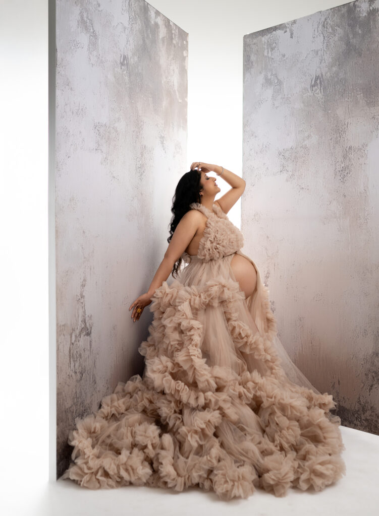 Mom in cream dress with large panel backdrops. Atlanta Maternity Photography.