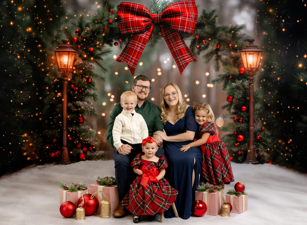 Family taking holiday photos in studio.