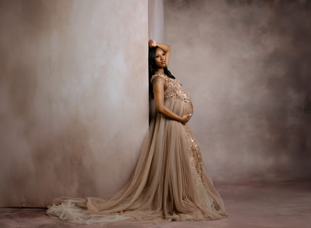 Women at Atlanta photo studio take maternity portraits.