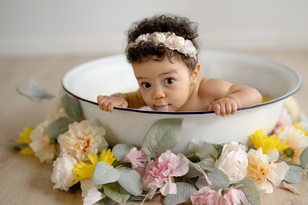 Baby girl in tub with flowers. Photo taken by Jenni Nikki at Atlanta photos studio in GA.