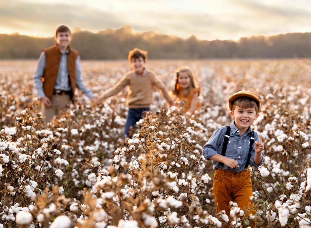 Cotton field mini session with kids running around in the field taking pjhotos.