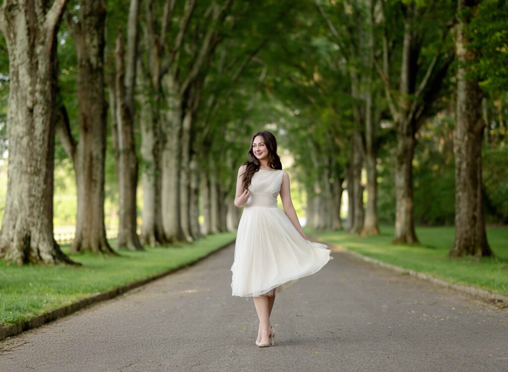 Senior grad walking through Berry collage near Atlanta.